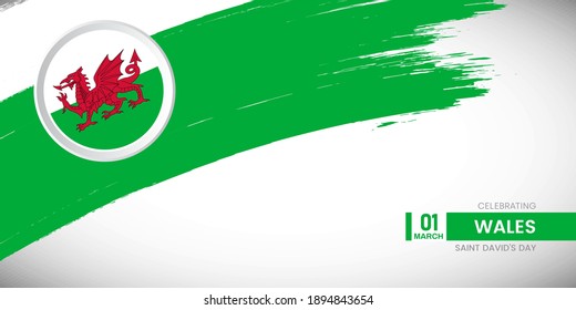 Creative brush stroke with flag of Wales country. Happy saint davids day background with grunge flag