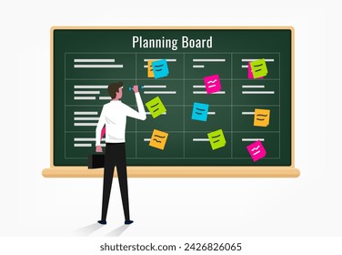 Creative business man organizing ideas and posting them on the blackboard, scrum methodology task board full of tasks on post it note cards