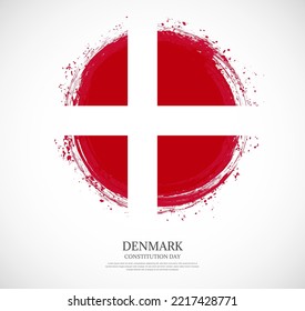 Creative circular grungy shape brush stroke flag of Denmark on a solid background