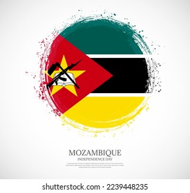 Creative circular grungy shape brush stroke flag of Mozambique on a solid background