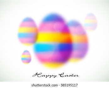 Creative colorful blurred Eggs on grey background for Happy Easter celebration.