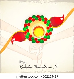 Creative colorful rakhi on stylish background for Indian festival of brother and sister love, Happy Raksha Bandhan celebration.