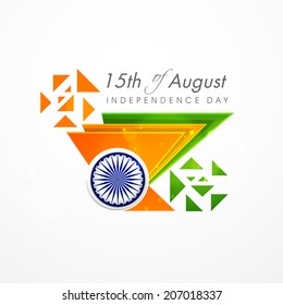 Creative concept for Indian Independence Day celebrations with triangles in national tricolors and Asoka Wheel on grey background. 