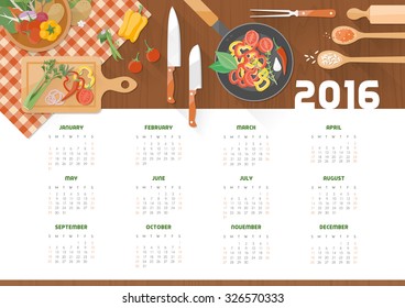 Creative cooking calendar 2016 with kitchen utensils and vegetables on a wooden worktop, top view