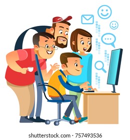 Creative coworkers smiling while standing by male colleague at computer desk in office