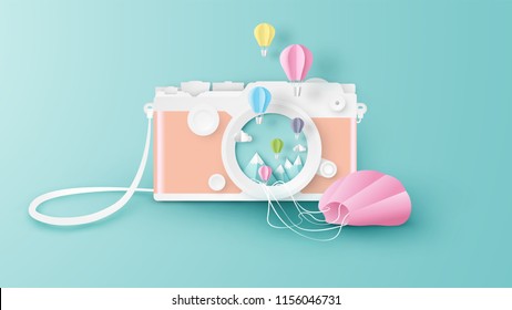 Creative design for camera with hot air balloons floating out of the camera lens. Abstract for camera with Hot air balloon festival. Hot air balloons festival. paper art style. vector, illustration.