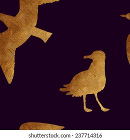 Creative design with golden silhouettes of a seagulls. Seamless pattern with golden oceanic animals.