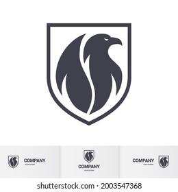 Creative Eagle Logo Inside Shield. Concept Inspiration Template. Modern Professional Hawk Logo Design. Phenix Head Logo Illustration on White Backdrop