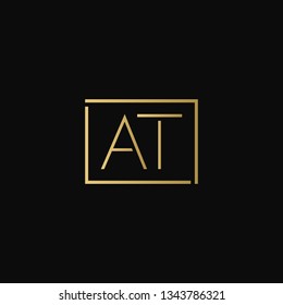 Creative elegant minimal AT artistic square shaped black and gold color initial based letter icon logo