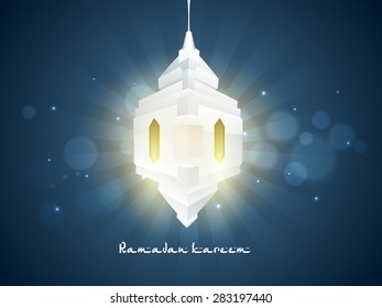 Creative glossy traditional lantern hanging on blue shiny rays background for Islamic holy month of prayers, Ramadan Kareem celebration.