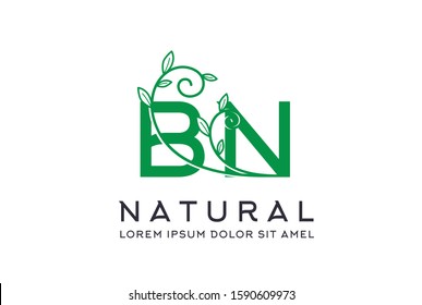 Creative green floral wedding initial BN icon design. Vector logo template