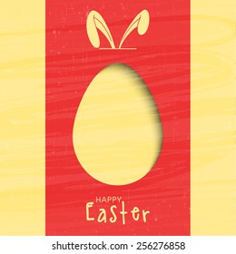 Creative greeting card design decorated with paper cut out egg and bunny ears for Happy Easter celebration.