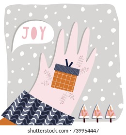 Creative hand drawn card for winter holidays with gift in a hand. Vector cartoon illustration. Hand drawn typography poster. Xmas design. Pink, orange and blue