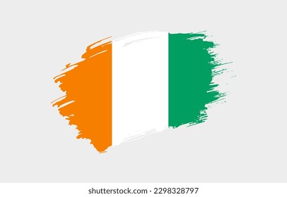 Creative hand drawn grunge brushed flag of Cote dIvoire with solid background