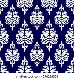 Creative hand drawn seamless damask pattern with fish drawing. Luxury Art Deco wallpaper collection. Floral motifs, bohemian elements, royal lilies. White on dark blue.