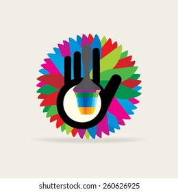creative hand with painting brush over colorful background
