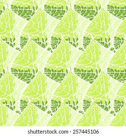 Creative hand-drawn abstract seamless pattern of stylized leaves in yellow and green tones