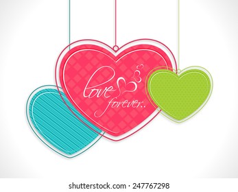 Creative hanging hearts with text Love Forever on shiny white background for Happy Valentines Day celebration.