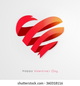 Creative heart made by glossy ribbon on grey background for Happy Valentine's Day celebration.