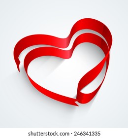 Creative heart shape made by glossy red ribbon on grey background for Happy Valentines Day celebration.