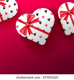 Creative heart shaped gift boxes with ribbon for Happy Valentine's Day celebration.