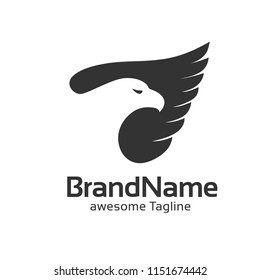 creative hidden eagle head on wings logo vector