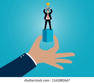 creative idea. hand holding a box there are businessman standing holding a trophy. leadership. advantage. business success concept. vector Illustration