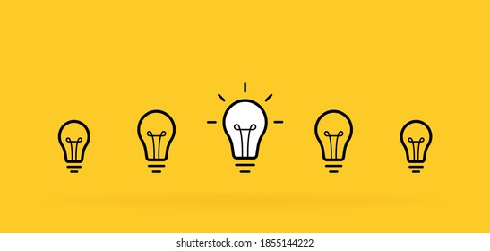 Creative idea. Set of standing light bulbs. Light with rays isolated on yellow background. Vector illustration.