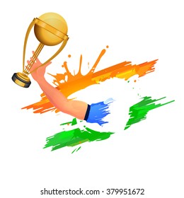 Creative illustration of a Cricket player's hand holding golden trophy on Indian Tricolor paint stroke background.