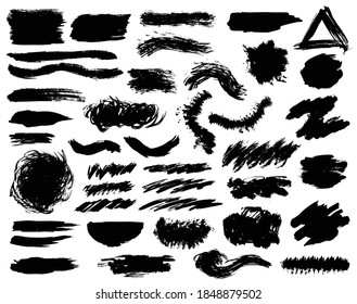 Creative isolated paint brush strokes or spots. Ink smudge abstract shape stains and smear set with texture. Grunge design elements. Collection of different brushes and drops