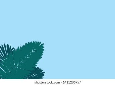 Creative layout made of colorful tropical leaves on blue background. Minimal summer exotic concept with copy space. Border arrangement
