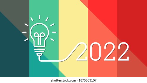 Creative light bulb idea with 2022 new year design with a light-bulb on the beautiful color palette background. 2022 glowing
