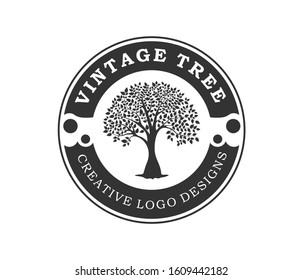 Creative luxury Tree nature sign logo design vector template. Vintage circular badge logo with tree silhouette.