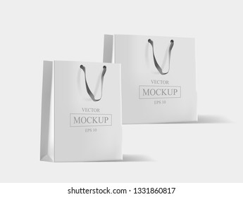 Creative mockup. Shopping bag. Mock-up of blank package, mockup of white paper shopping bag with handles. Vector illustration