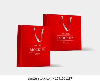 Creative mockup. Shopping bag. Mock-up of blank package, mockup of red paper shopping bag with handles. Vector illustration.