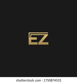 Creative modern elegant trendy unique artistic black and GOLDEN color EZ ZE E Z initial based letter icon logo.