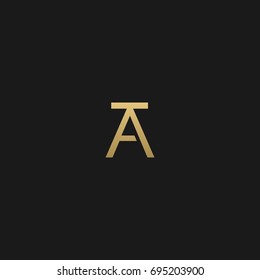 Creative modern unusual geometric artistic black and gold color AT TA A T initial based letter icon logo.
