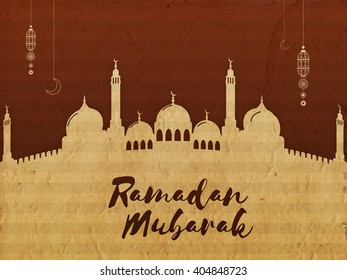 Creative Mosque made by cardboard on brown background for Islamic Holy Month of Prayers, Ramadan Mubarak celebration.
