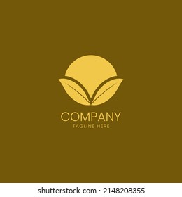 A creative nature logo featuring golden leaves and a stylized sun.