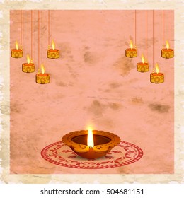 Creative Oil Lamp (Diya) with rangoli and hanging illuminated candles on vintage background, Greeting Card design for Indian Festival of Lights celebration.