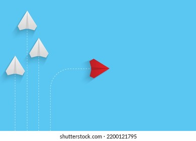 Creative paper planes on blue background. Think differently concept. Red airplane changing direction. New idea, change, trend, courage, creative solution, innovation and unique concept.