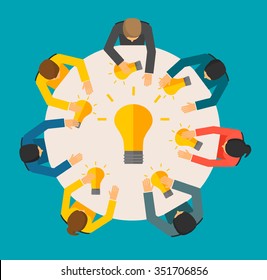 Creative people concept. Team meeting top view, people holding lightbulbs. Idea creating symbol