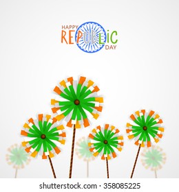 Creative pinwheels on grey background for Happy Indian Republic Day celebration.