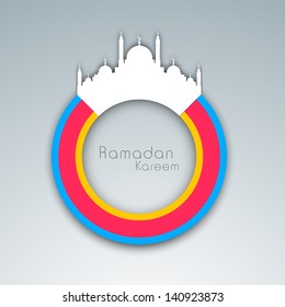 Creative Ramadan Kareem background with white mosque on colorful circle.
