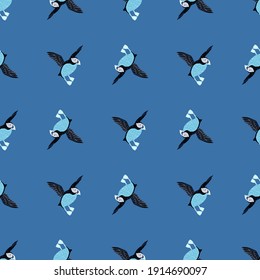 Creative seamless pattern with simple puffin bird silgouettes. Blue background. Biology zoo print. Flat vector print for textile, fabric, giftwrap, wallpapers. Endless illustration.