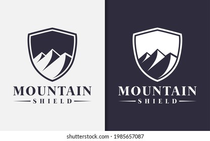 Creative Shield and Abstract Mountain Silhouette Combination Logo Design.