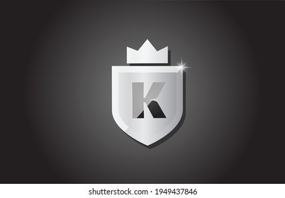 Creative shield K alphabet letter logo icon in grey color. Corporate business design for company template identity with king crown and light spark