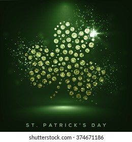 Creative shiny Shamrock Leaf on green background for Happy St. Patrick's Day celebration.