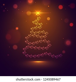 Creative, shiny xmas tree made by snowflakes on brown bokeh background with space for your message.