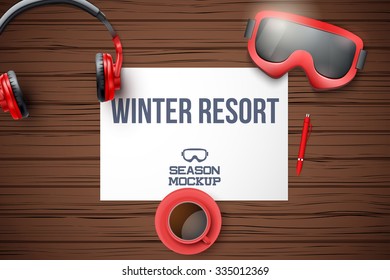 Creative ski workplace with white paper and dark wood background. Winter ski theme. Top view.